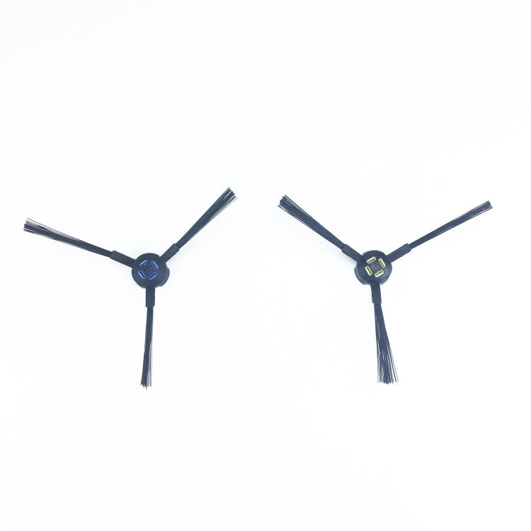 Two robotic vacuum side brushes with dark bristles and black stems, blue hubs visible