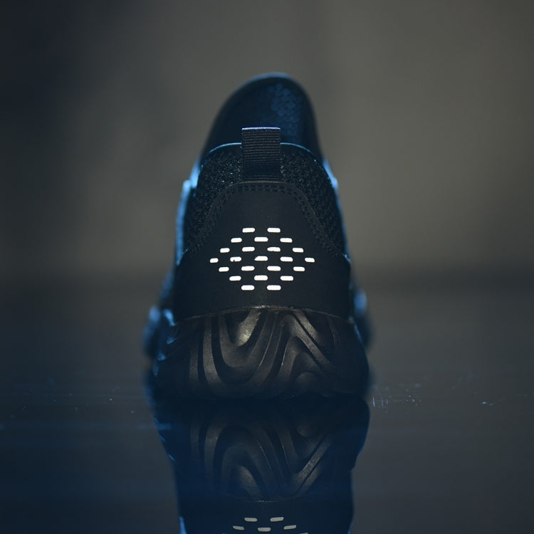 Front view of black work safety shoe with perforated toe guard and lace closure