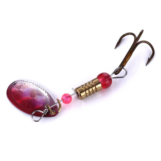 Metal sequin fishing lure with red bead, treble hook, brass coil body