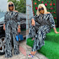 Women's black-and-white striped off-shoulder long-sleeve jumpsuit with wide legs